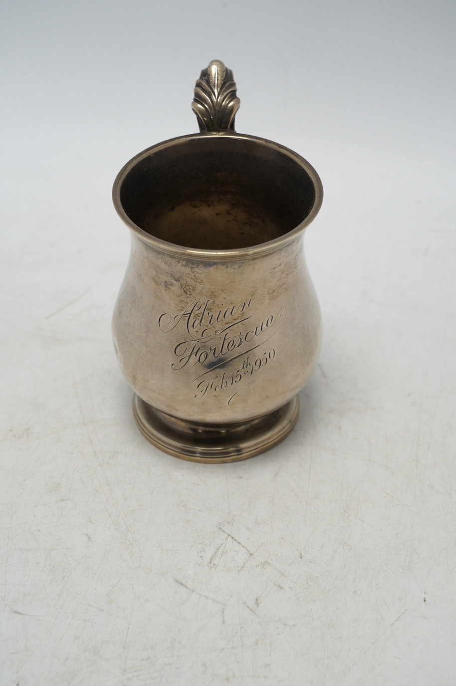 A William IV silver baluster christening mug, maker's mark rubbed, London, 1832, 11.8cm, 7.5oz, with later engraved inscription. Condition - poor